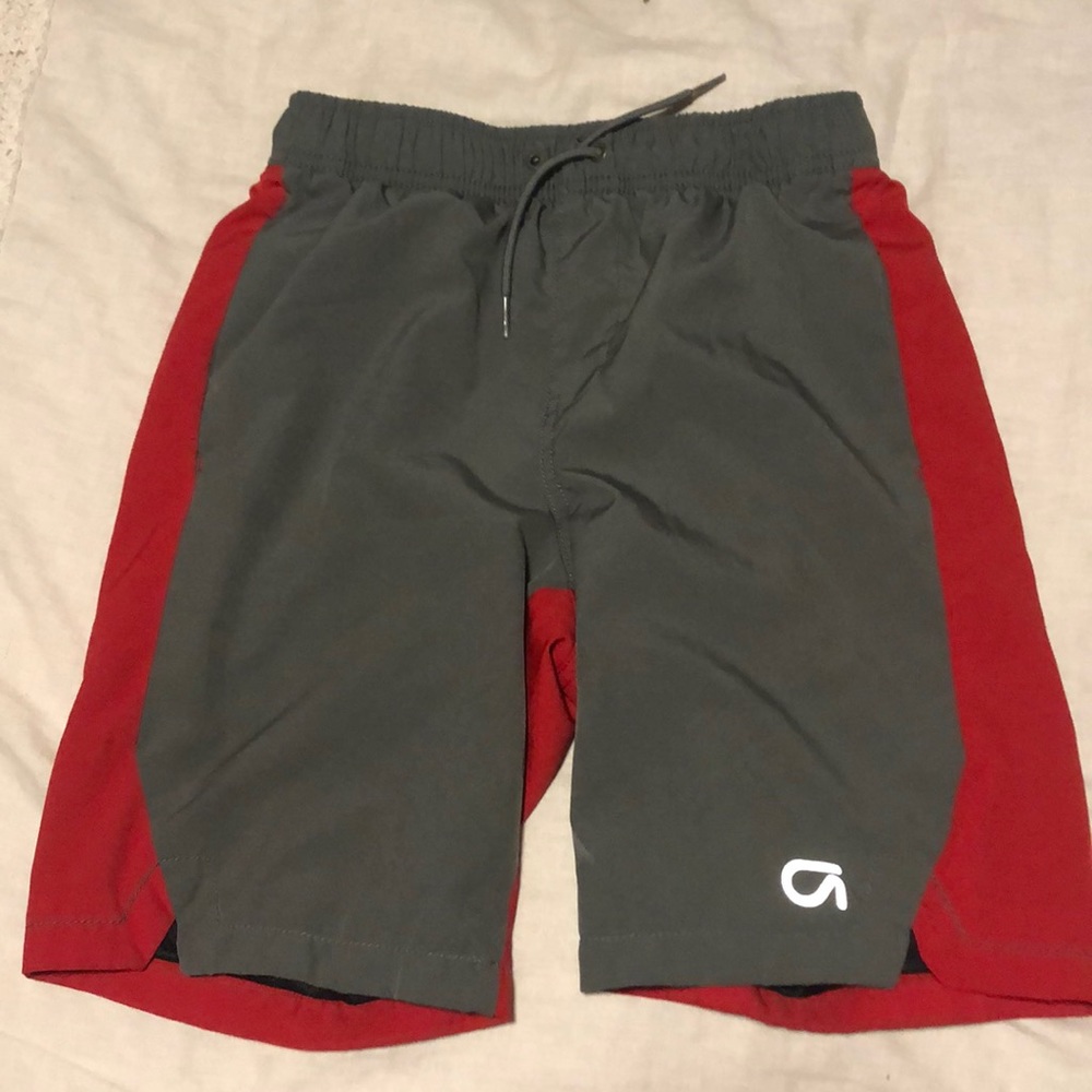 Boys red and gray swim trunks